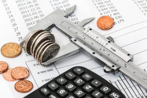 Azalia Debt Repayment Canva Coins and Calculator on a Invoice 300x200